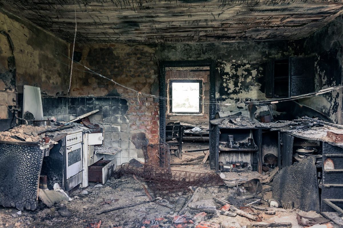 A fire- and smoke-damaged interior, the kind of scene fire and smoke restoration addresses